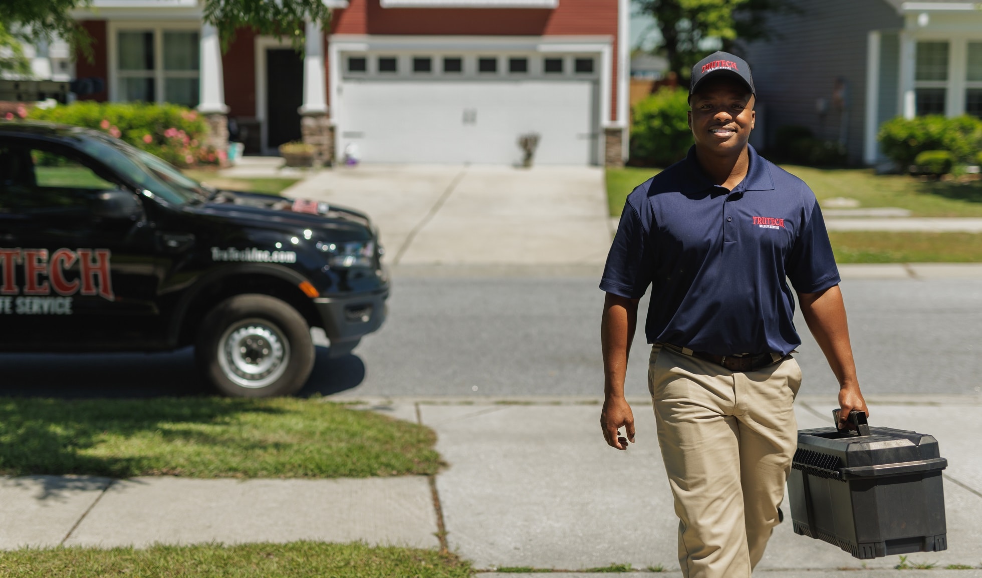 Wildlife control technician arriving at customer home